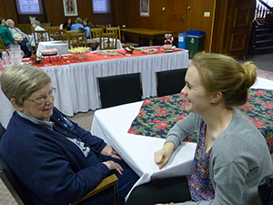 Sister Charles Allen Reynolds, CSC, enjoys hearing Saint Mary’s College student Maddie Cushing, right, recount highlights of the time the two spent together as part of an oral history project focused on faith-sharing.